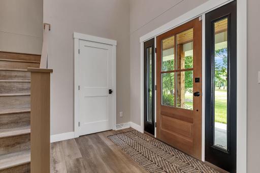 A welcoming front entryway featuring a beautiful front door that creates a warm and inviting first impression.