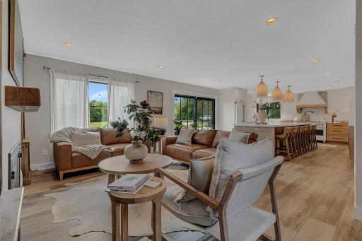 An inviting open-concept design connects the living room, kitchen, and dining area, creating a comfortable and cohesive space where everyone can gather, relax, and enjoy time together.