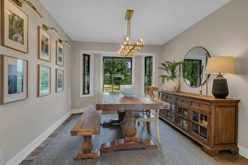 A generously sized formal dining room designed to comfortably accommodate a large dining table, making it the perfect setting for hosting family and friends.