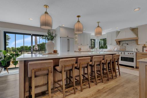 The oversized center island provides plenty of space for casual, informal dining, offering the perfect complement to the homeâs formal dining room and making this kitchen ideal for both everyday living and entertaining.