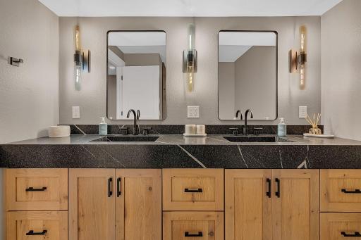 Another view of the stunning vanity and beautiful finishes in the lower-level bathroom, showcasing the thoughtful details throughout the space.