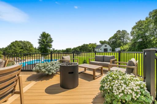 The deck features low-maintenance, heat-resistant materials and a thoughtfully designed layout with multiple seating areas, making it ideal for relaxing and entertaining.