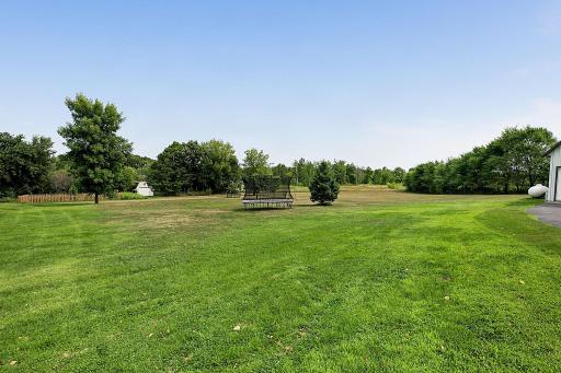 A beautiful view of the backyardâa peaceful space to relax, unwind, and enjoy time outdoors.