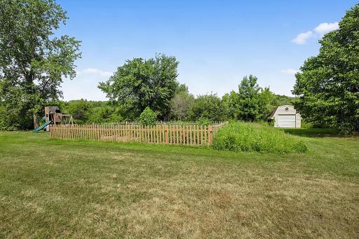 The property features a large fenced-in garden with irrigation, making it easy to grow, maintain, and enjoy your own garden all season long.