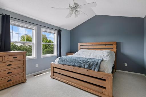 Primary bedroom suite with vaulted ceilings