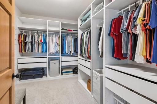 Huge custom walk-in primary closet, over 108 square feet of storage and hanging space.!
