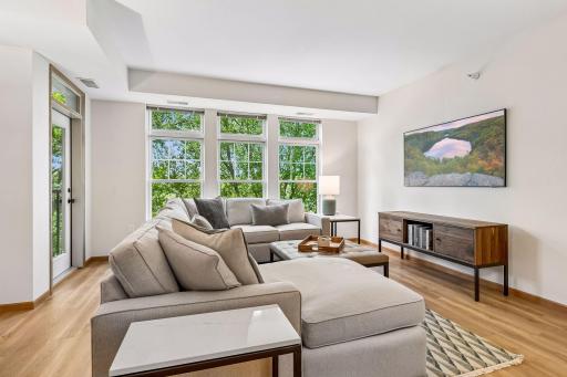 Clerestory windows enhancing your wooded view.