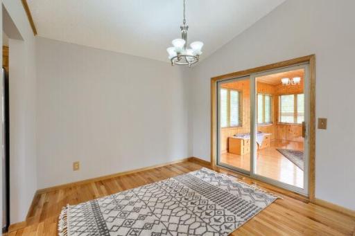 Wood Floor Dining Room Leads to Large 3 Season Porch
