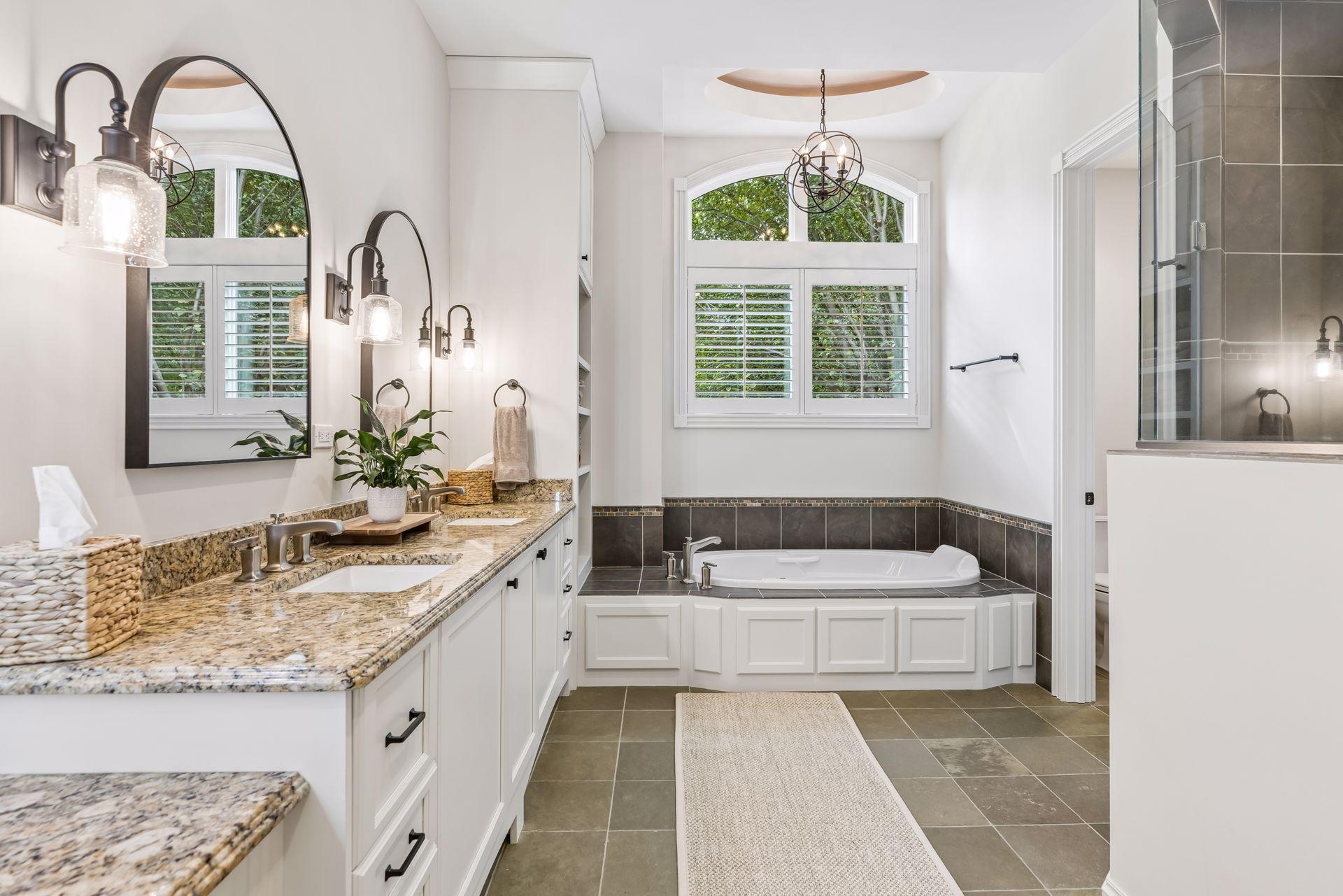 The generous primary ensuite showcases a relaxing soaking tub, an elegant double vanity, and an expansive shower.