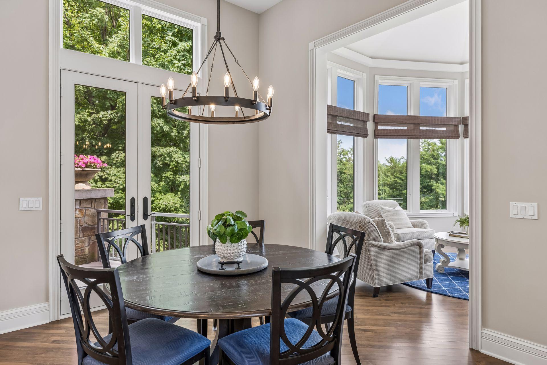 The informal dining room offers deck access and flows directly into the four-season porch.