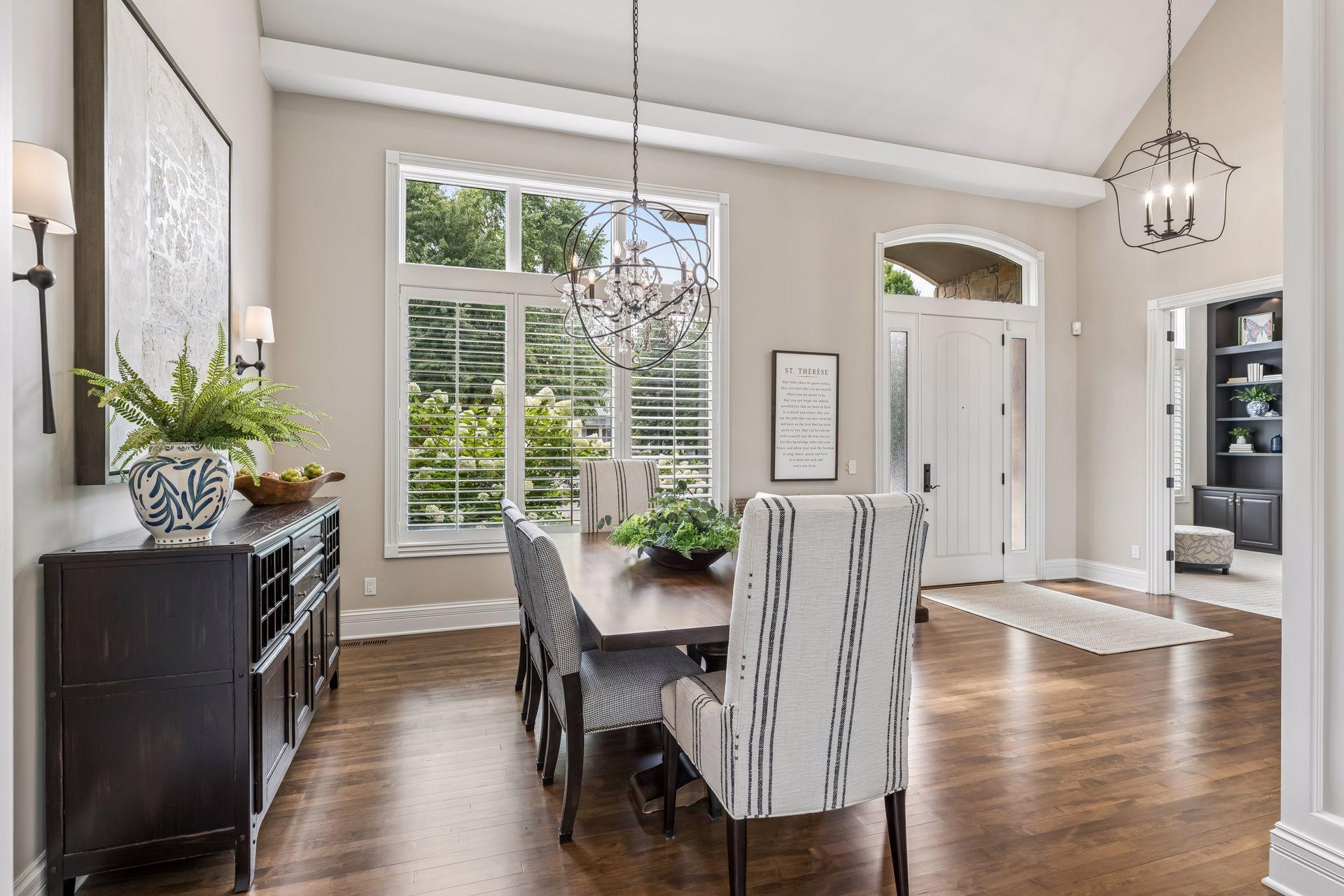 Wood floors throughout the dining, kitchen, and living room areas.