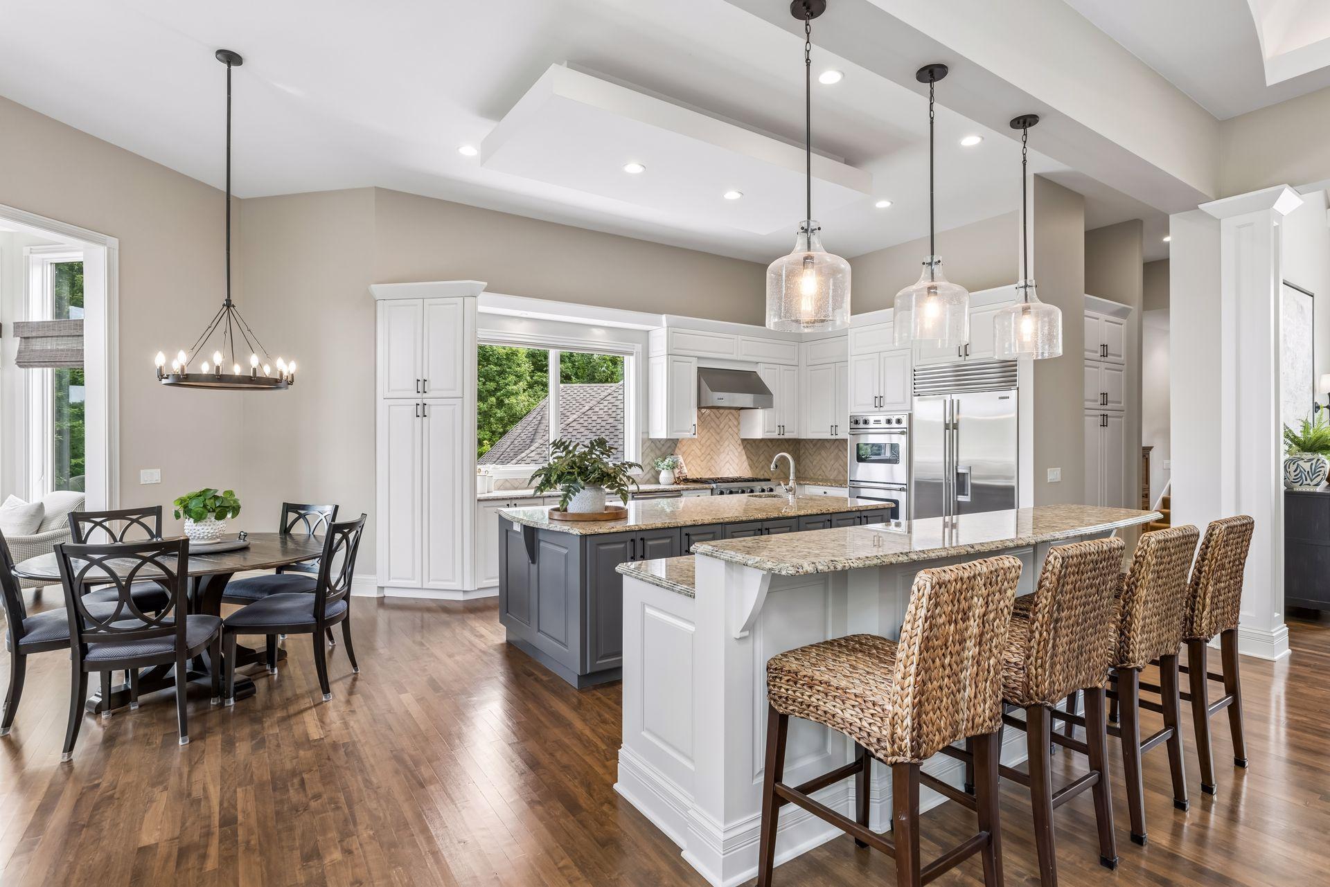The kitchen features two generous center islands, providing exceptional space for cooking and entertaining.