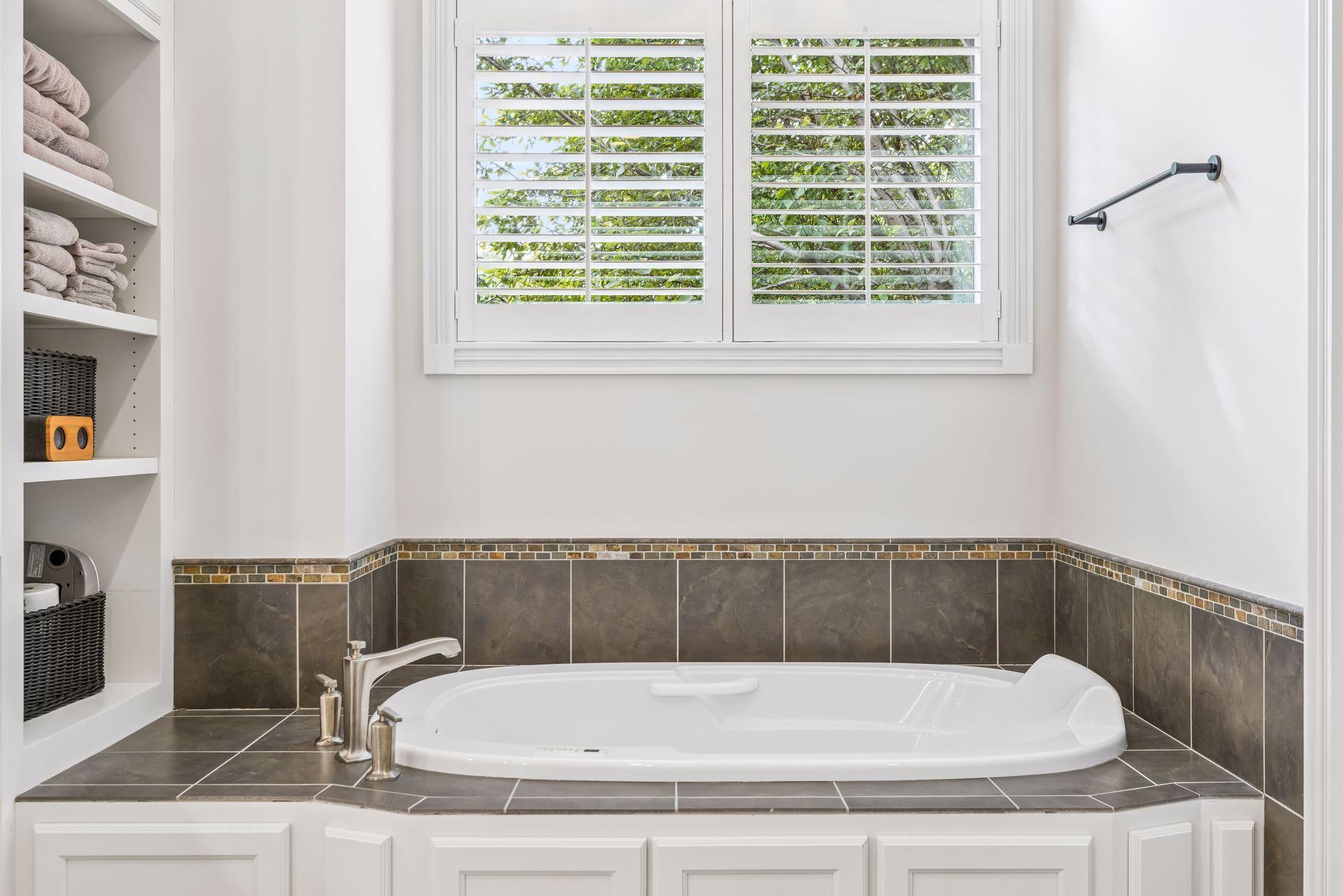 Soaking tub with convenient built-in shelving.
