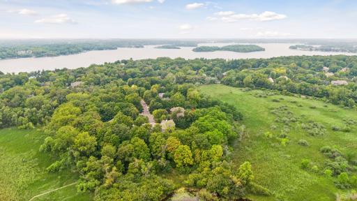 Aerial view showcasing the cul-de-sac, surrounding natural wetlands, and Smithtown Bay on Lake Minnetonka.