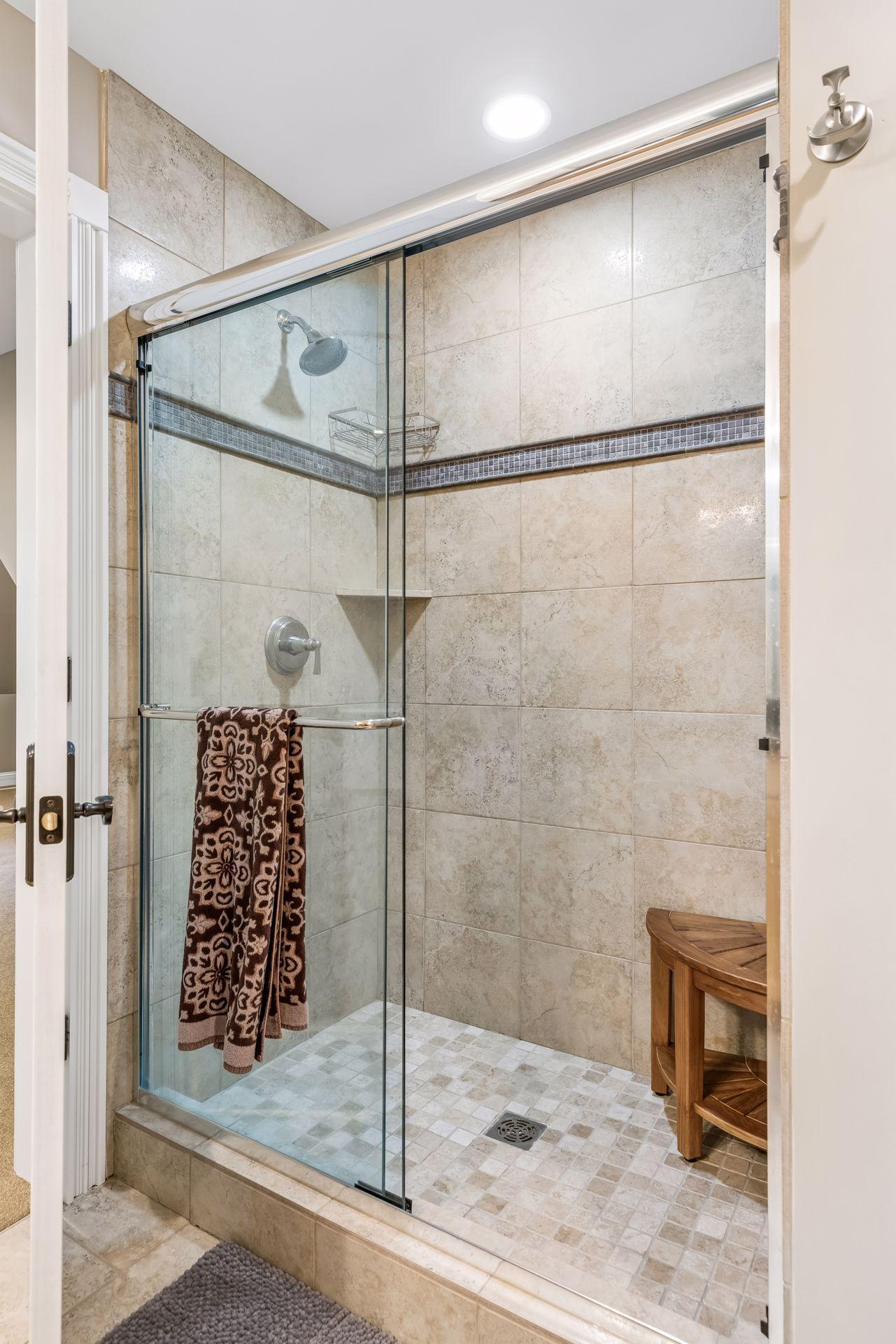 Shower in upper level bathroom off of the bonus room.