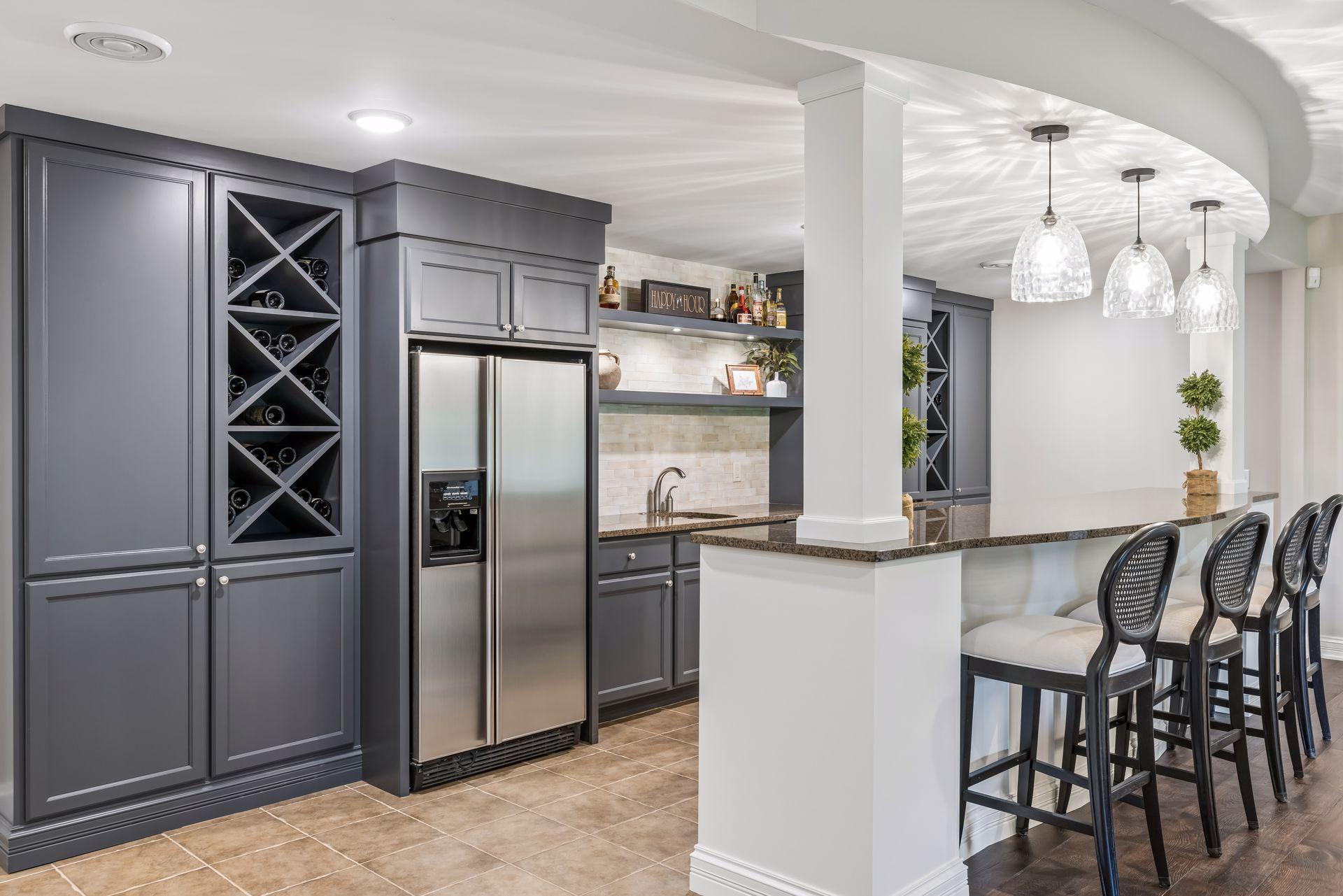 Newly painted cabinets, dedicated wine storage, and tile flooring create a fresh, functional space.