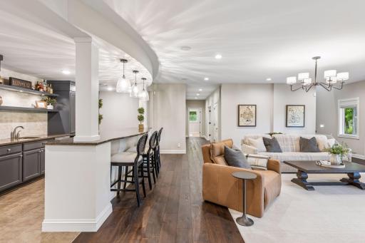 The hallway guides you to two comfortable bedrooms, two bathrooms, and a convenient utility room.