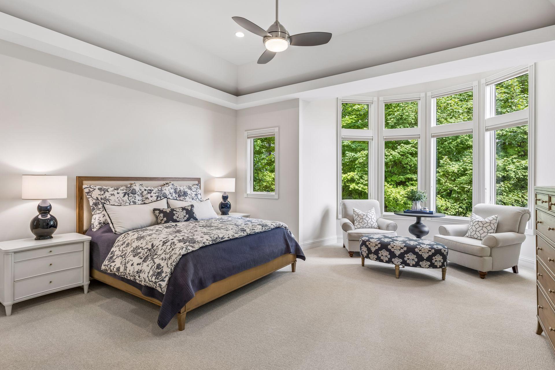 The spacious primary suite includes a beautifully appointed sitting area for relaxing and unwinding.