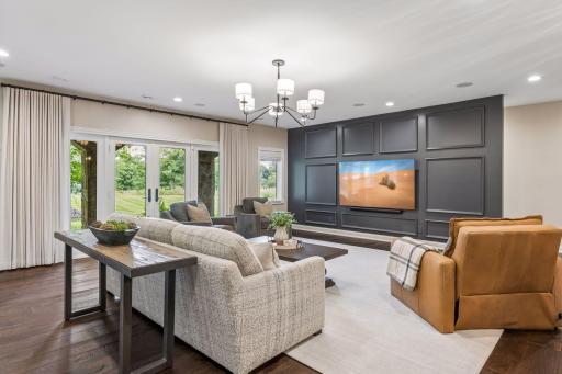 The lower level offers a generous family room and a walkout that opens directly to the expansive backyard.