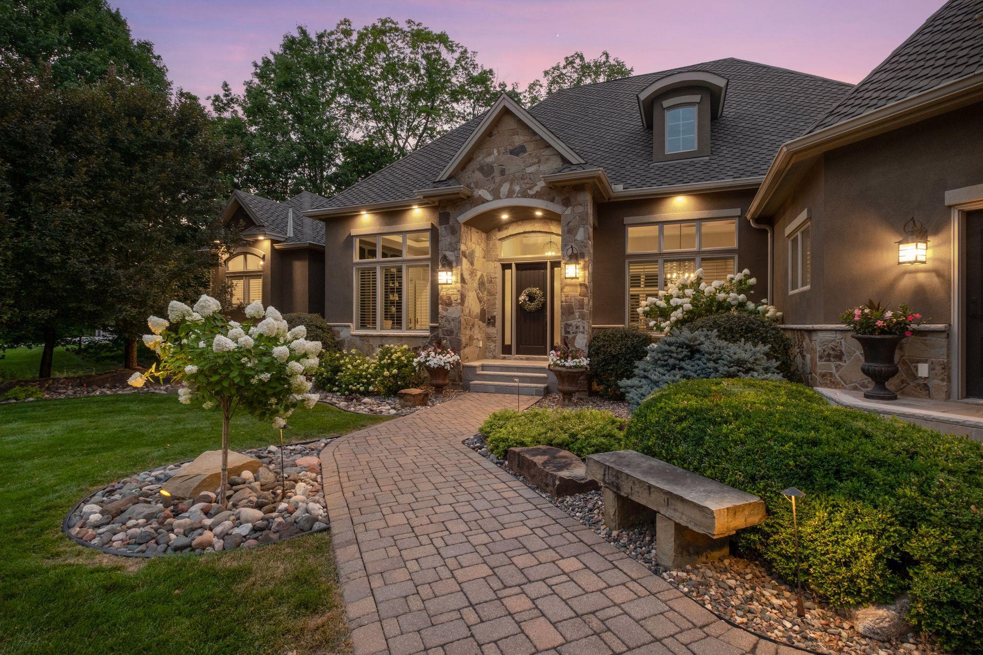 Inviting paved sidewalk leading to front porch.