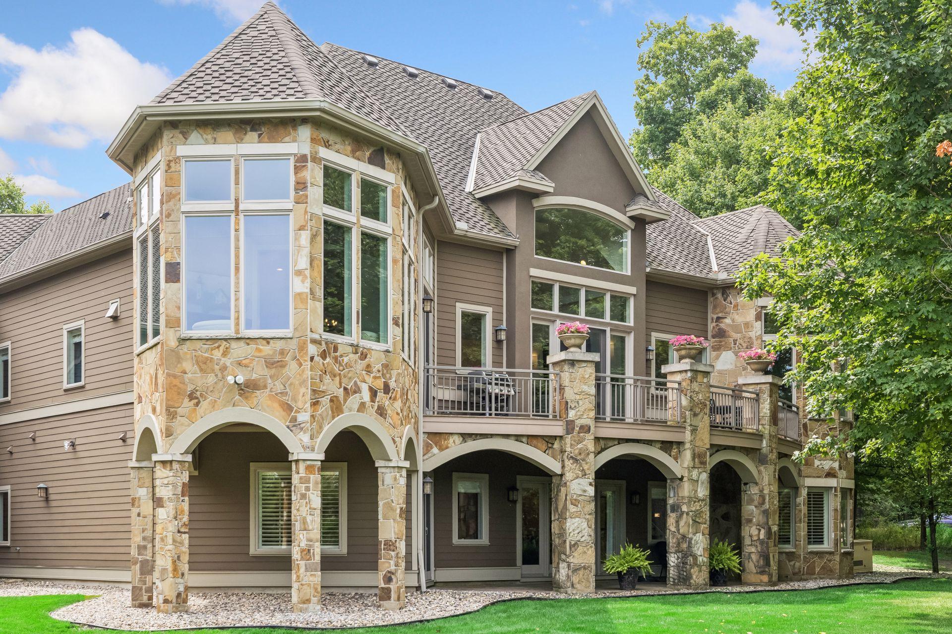 The expansive composite deck provides a beautiful vantage point over the home’s private, tree-lined backyard.