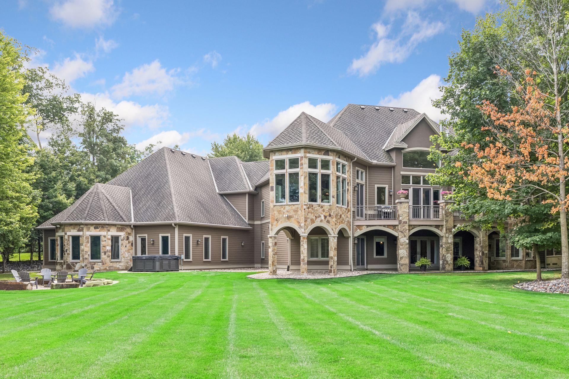 Generous patio spaces wrap around the back of the home, offering multiple areas to relax and entertain.