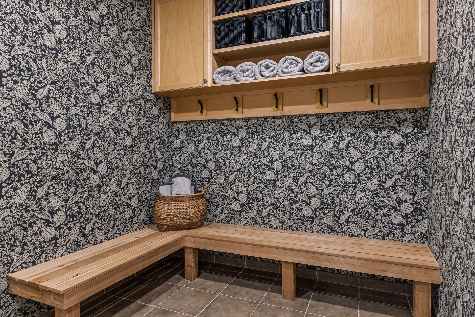 The lower level includes a convenient changing room located across the hall from the sauna and just steps from the sport court.