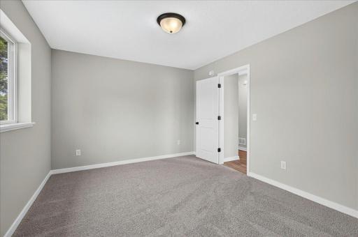 Bedroom 2. Photo taken of another home with similar plan and finishes.