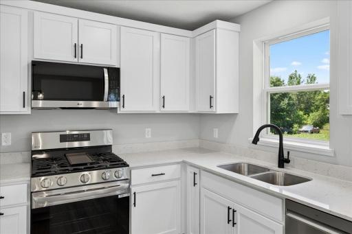 Photo taken of another home with similar plan and finishes.