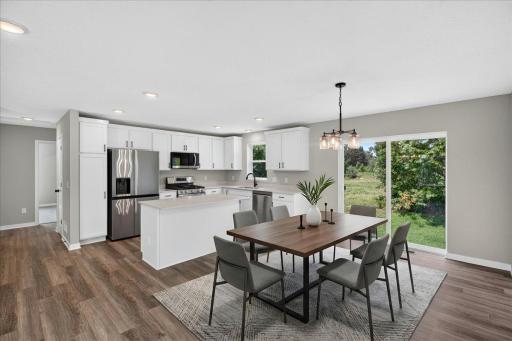 Photo taken of another home with similar plan and finishes. Dining Room.