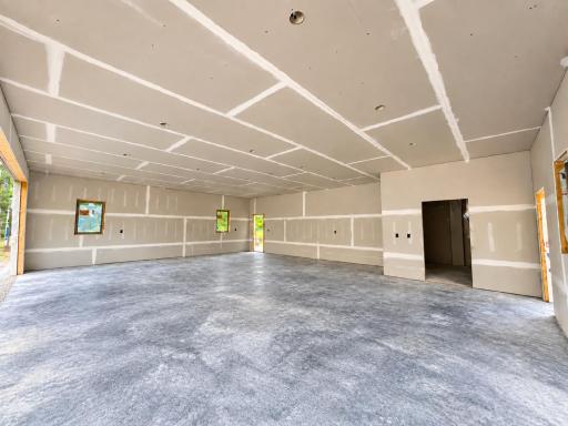 30x38 garage heated with radiant heat, floor drain and ceiling fan. set up to add a separate air exchanger for the garage separately.