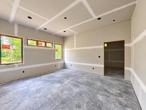 Primary bedroom on main floor with attached ensuite with laundry and large walk in closet.