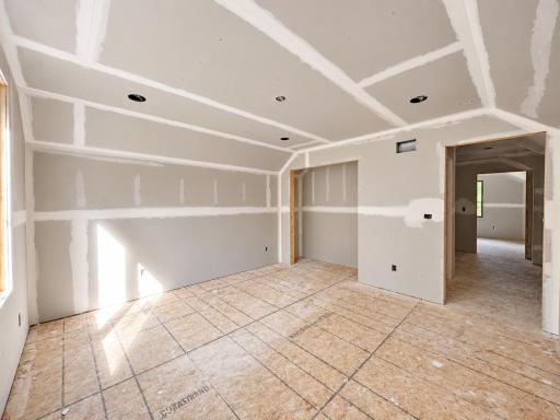 2nd bedroom closet and hallway leading to bathroom and 3rd bedroom