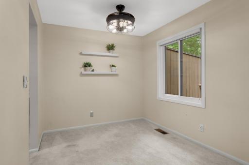 The cool light fixture in the dining room also converts to a fan, and don't miss the updated windows.