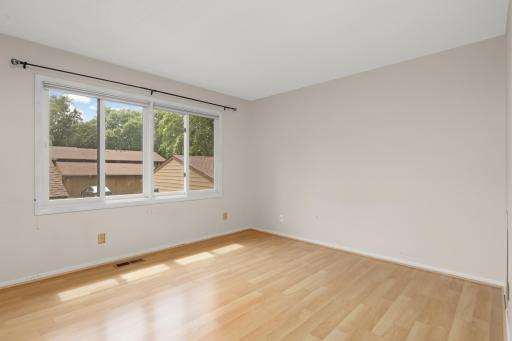 The main floor features a large sunny primary bedroom.