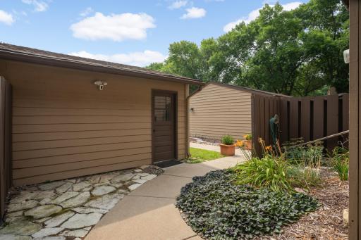 The one-car detached garage features a garage door opener and also parking in the driveway. A cute little private patio is situated between the house and the garage.