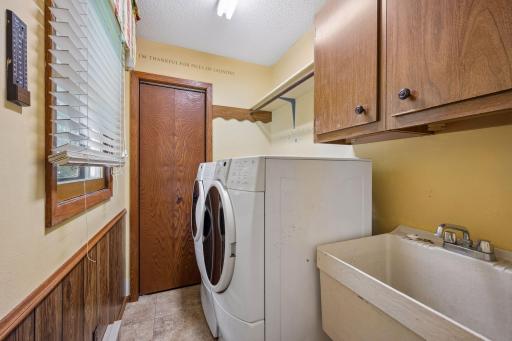 Main floor laundry with large storage closet