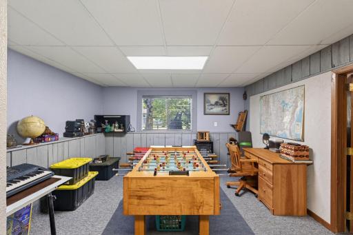 The finished lower level offers plenty of space for games, hobbies, music, and work.
