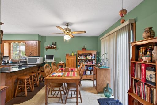 The dining area creates a welcoming setting for everyday meals, featuring a generous space for a dining table and chairs, ample natural sunlight, and a seamless connection to the kitchen.