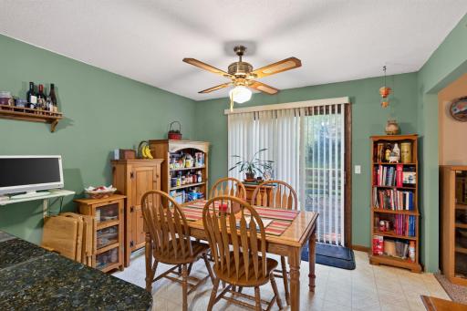 The dining room offers a sliding patio door that opens onto the deck for easy indoor-outdoor living. The ceiling fan ensures year round comfort.