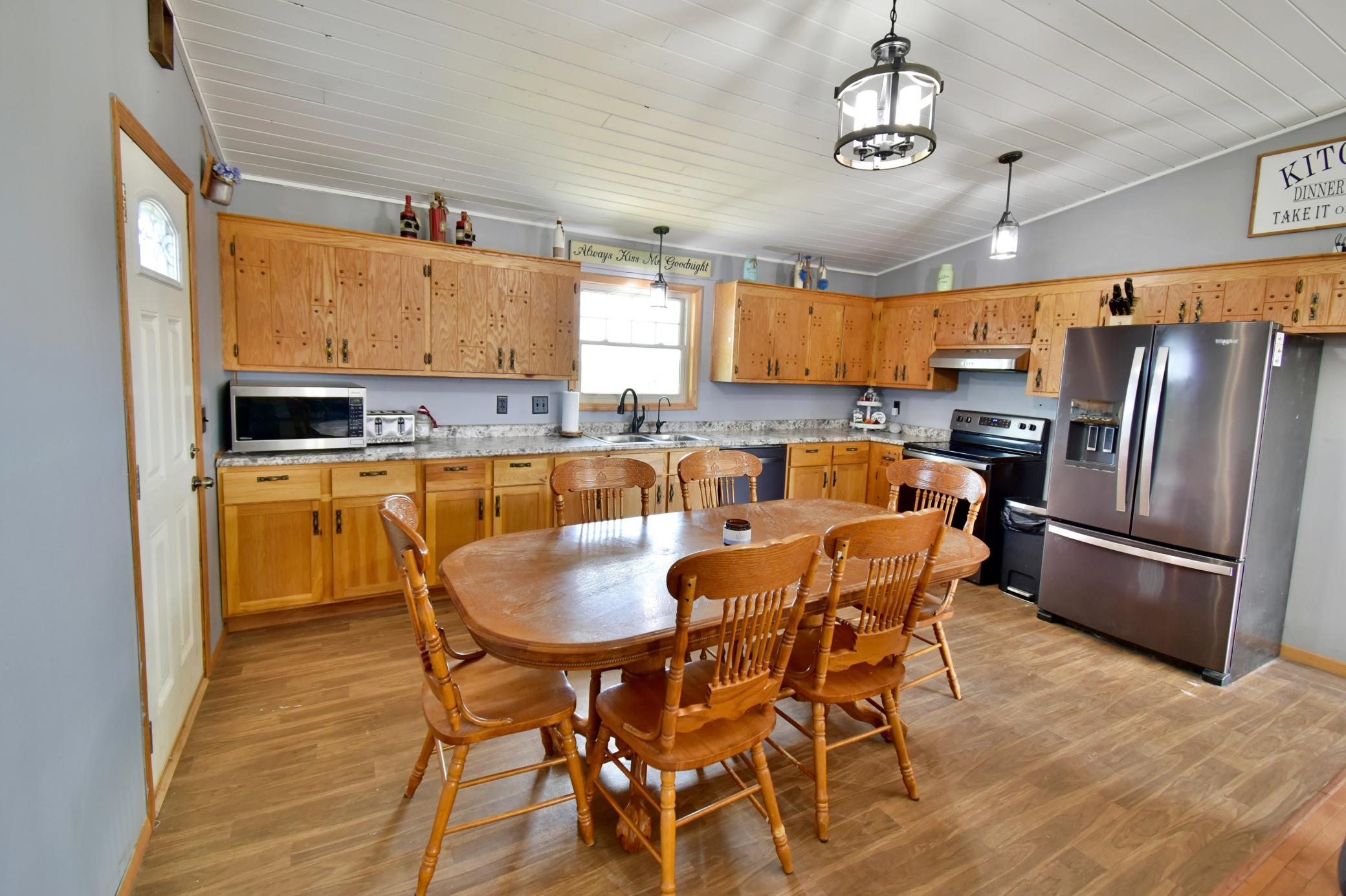Continuing the open concept feeling into the dining area and kitchen.