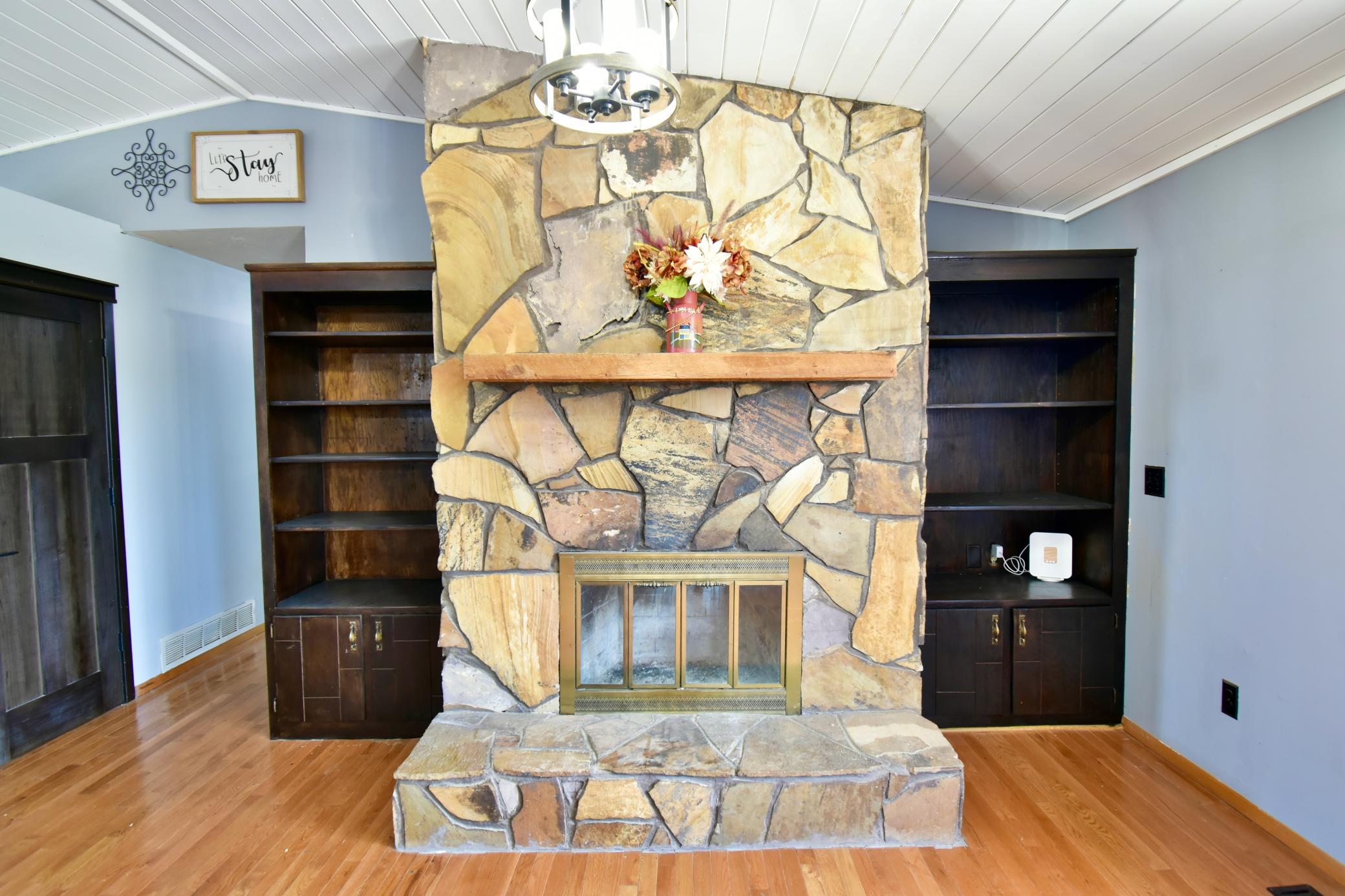 The focal point of the living room area is this large stone fireplace, sure to get used on many Minnesota winter evenings