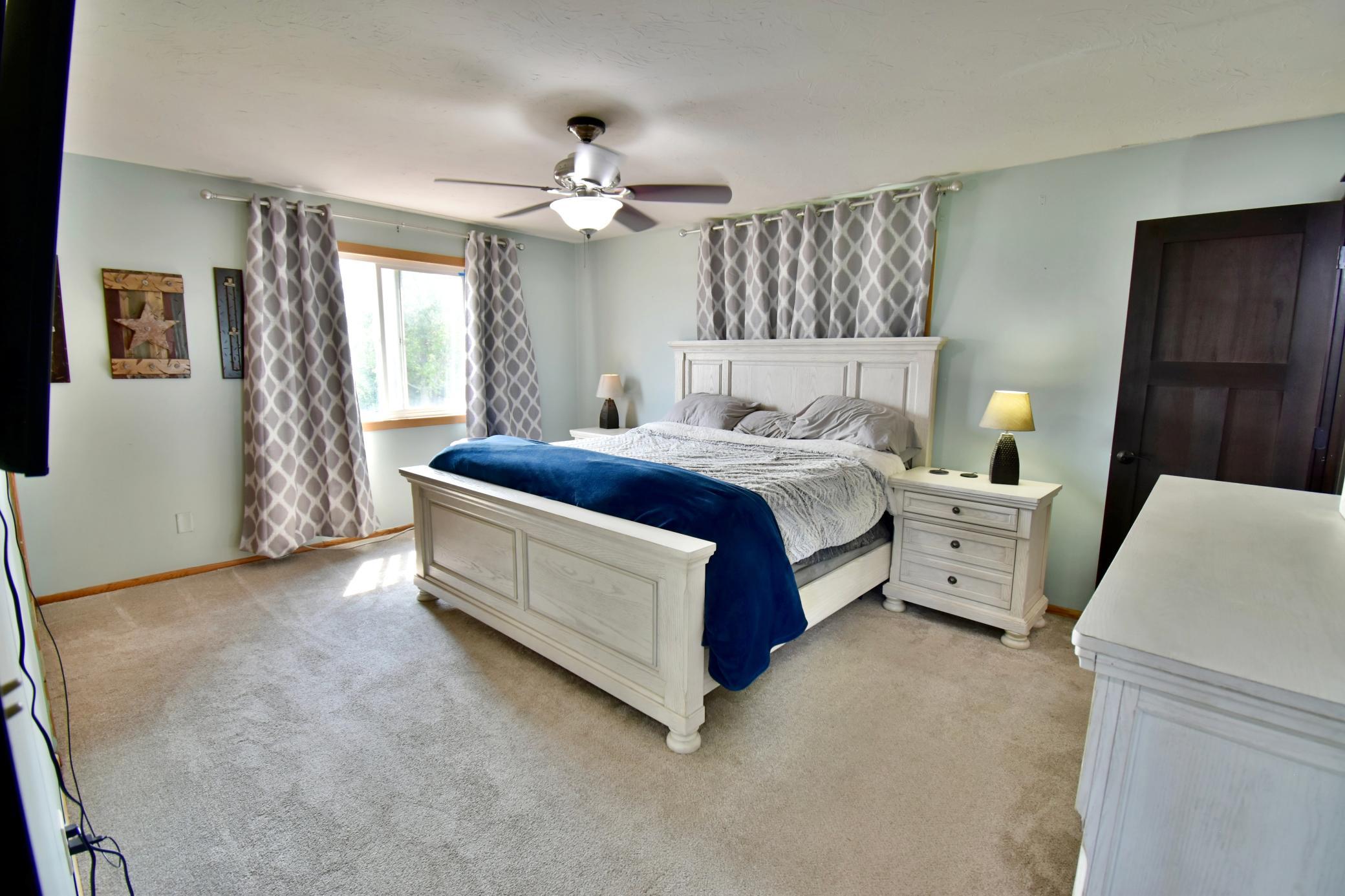 Primary bedroom with plenty of room and lots of natural light