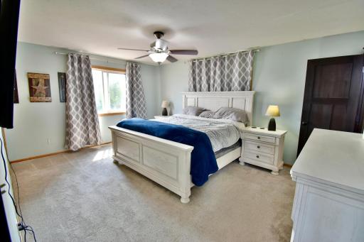 Primary bedroom with plenty of room and lots of natural light