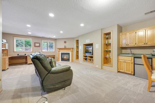 Don't miss the WET BAR, fireplace and built-ins!!