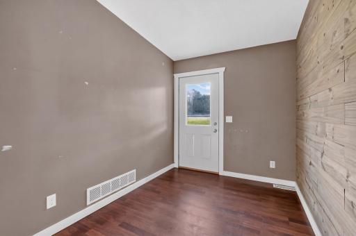 Entry coming in from the east exterior door and could easily be a second area for an office.