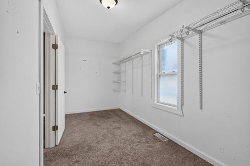 Primary 7 x 19 walk in closet with window.
