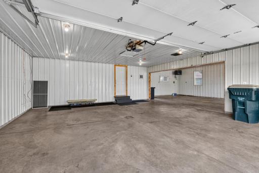 24 x 24 with additional 18 x 30 with 2 OH doors, automatic openers and insulated doors PLUS plubing with a stainless steel sink.