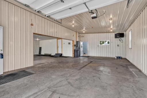 This garage is one of the brag points of this property - oversized with 1116 sf of man space with concrete floors, 2 floor drains, metal walls and ceiling, additional electric with outlets half wall up all around for multiple workbench additions.