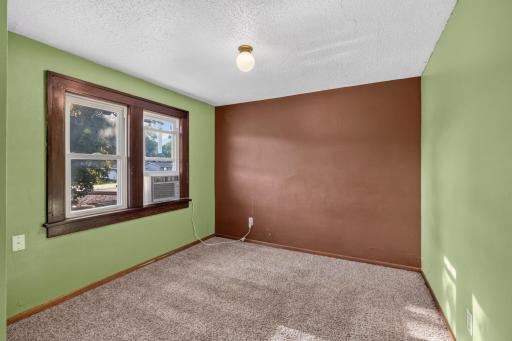 Upper level bedrrom with 2 windows and large closet. Home comes wiwth 3 AC window units.